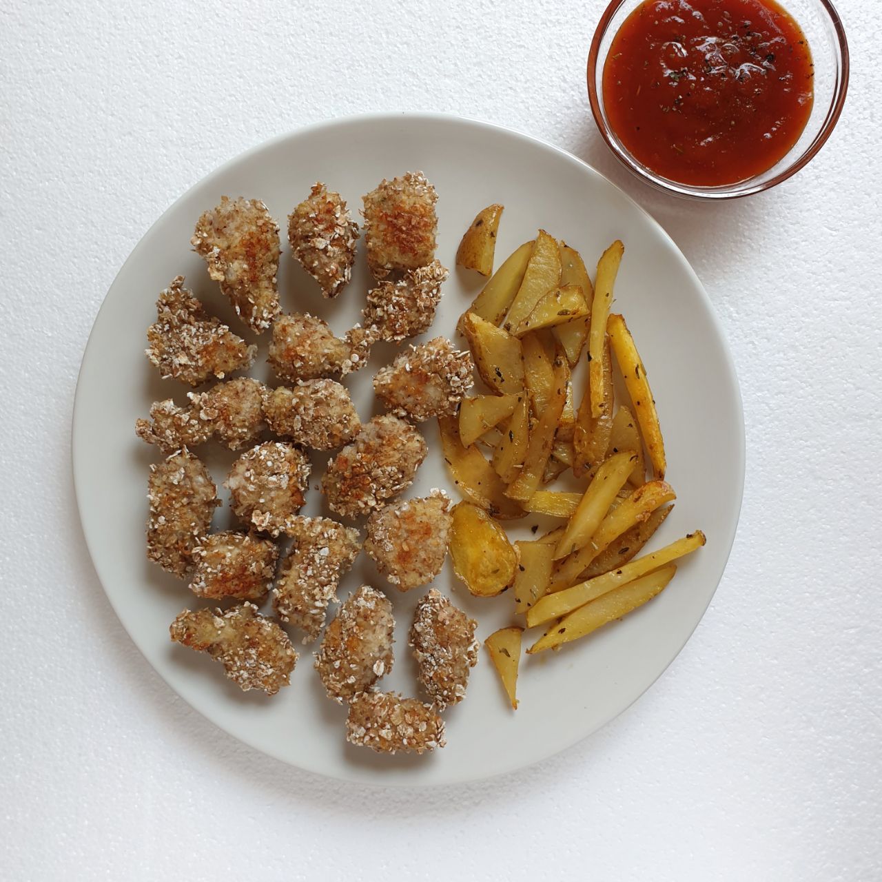 Pollo rebozado con patatas no fritas